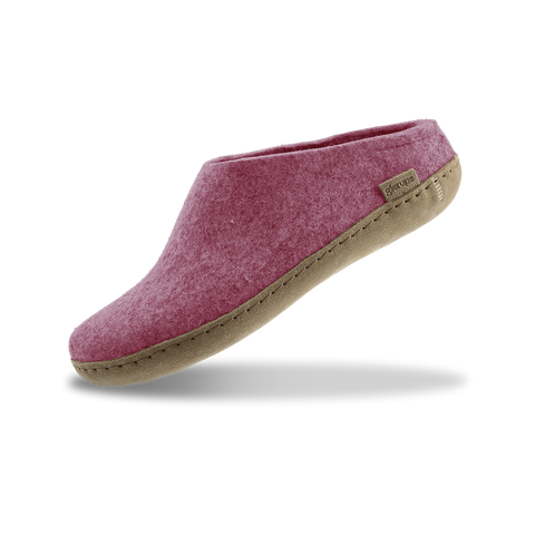 Blossom pink slipper with leather sole on a white background